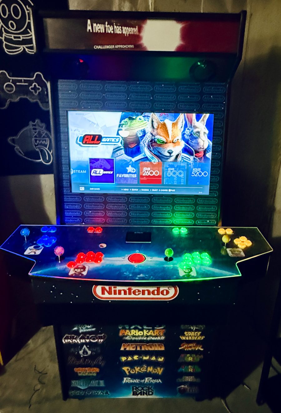Finished cabinet lit up in the game room